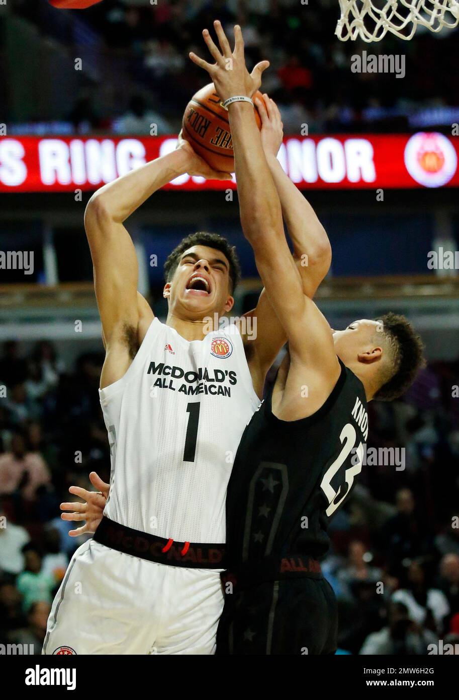 Big West's Michael Porter Jr., left, drives to the basket against Big