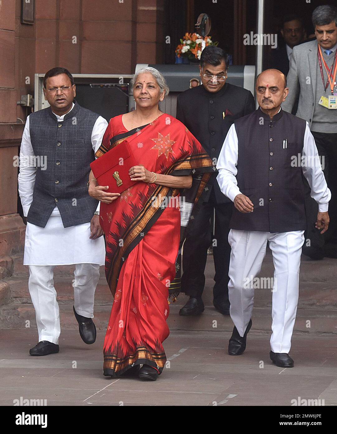 NEW DELHI, INDIA - FEBRUARY 1: Union Finance Minister Nirmala Sitharaman with Ministers of State Bhagwat Kishanrao Karad and Pankaj Chaudhary and officials poses for photographs outside the Finance Ministry ahead of the presentation of the Union Budget 2023-24 at North Block, on February 1, 2023 in New Delhi, India. Nirmala Sitharaman presented the last full-fledged Union Budget of the Modi government before the 2024 Lok Sabha elections. The government sweetened the new income tax regime by making income of up to ?3 lakh exempt from income tax. With a rebate, now people earning up to ?7 lakh n Stock Photo