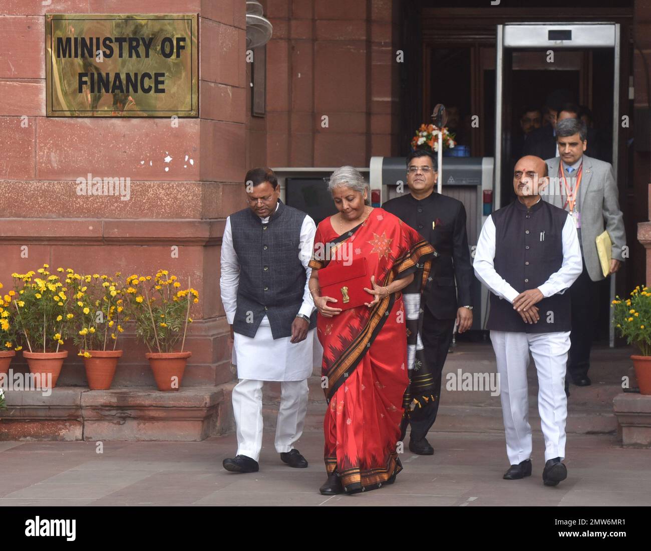 NEW DELHI, INDIA - FEBRUARY 1: Union Finance Minister Nirmala Sitharaman with Ministers of State Bhagwat Kishanrao Karad and Pankaj Chaudhary and officials poses for photographs outside the Finance Ministry ahead of the presentation of the Union Budget 2023-24 at North Block, on February 1, 2023 in New Delhi, India. Nirmala Sitharaman presented the last full-fledged Union Budget of the Modi government before the 2024 Lok Sabha elections. The government sweetened the new income tax regime by making income of up to ?3 lakh exempt from income tax. With a rebate, now people earning up to ?7 lakh n Stock Photo