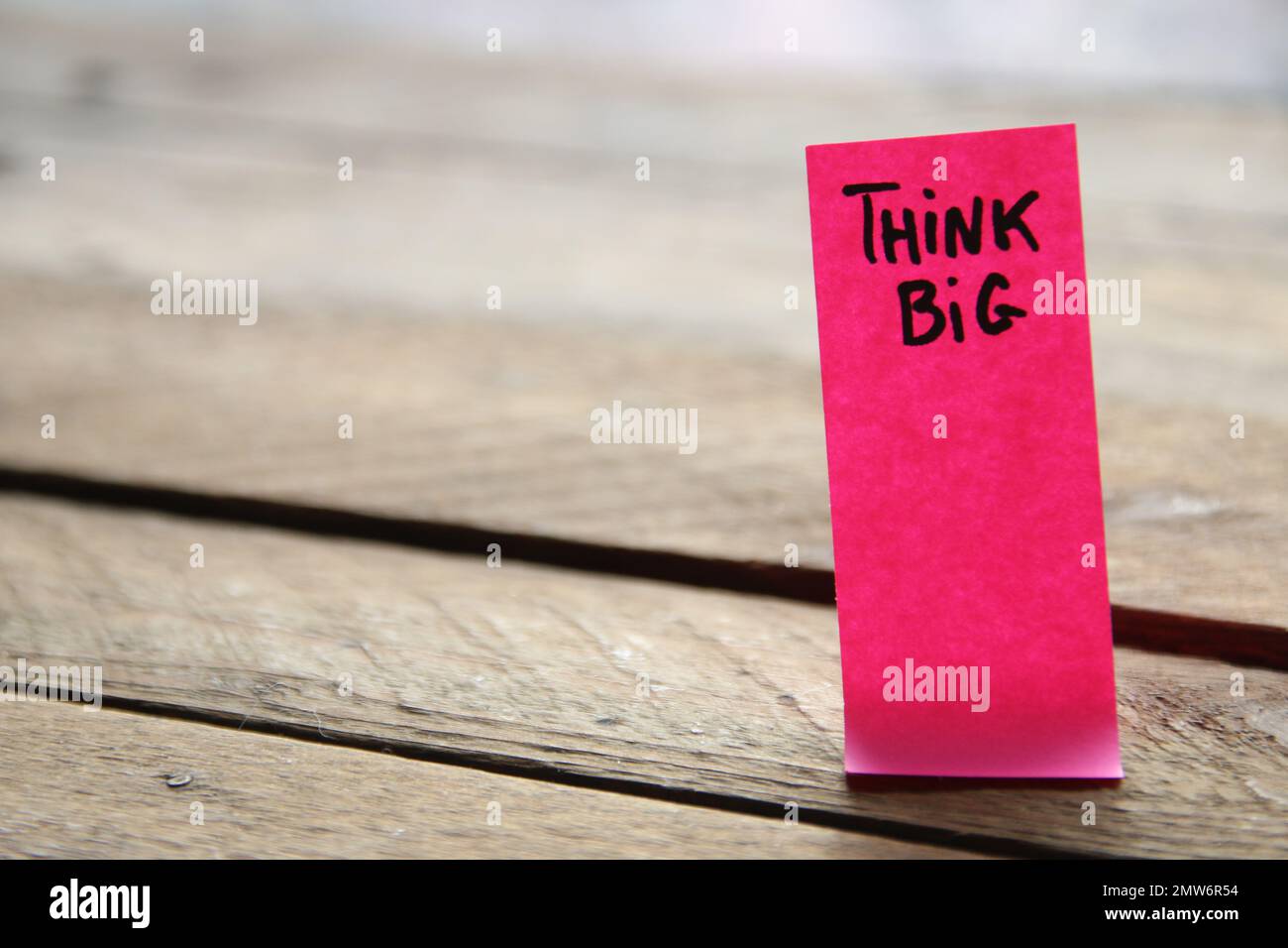 Motivational quotes inscription on a tag Creative concept. Think Big. Stock Photo