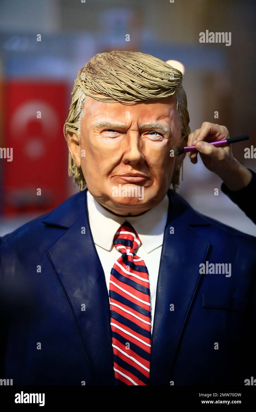 Turkish pastry chef Tuba Geckil, partially seen, poses for