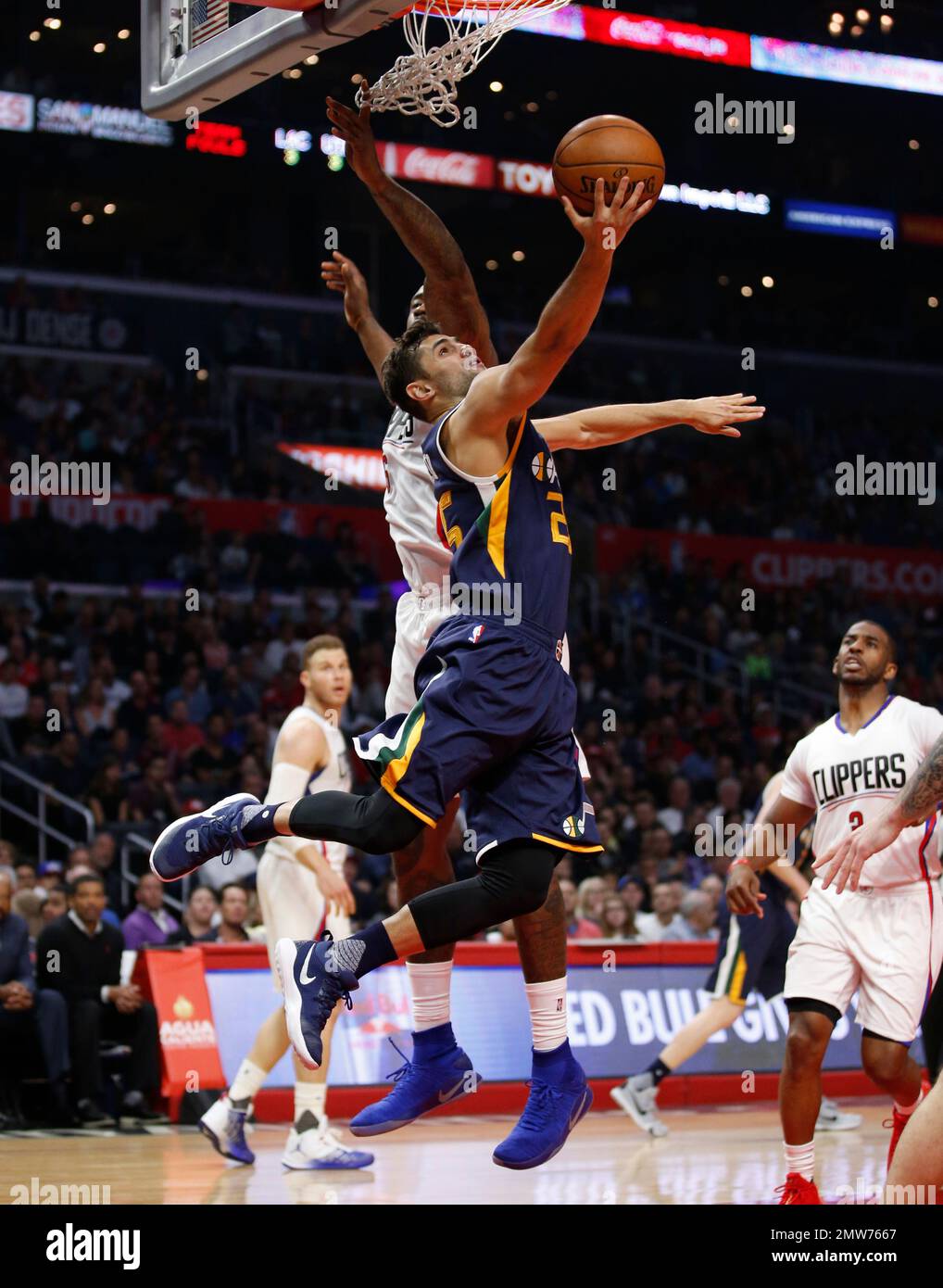 Utah Jazz guard Raul Neto goes to the hoop in front of Los Angeles ...