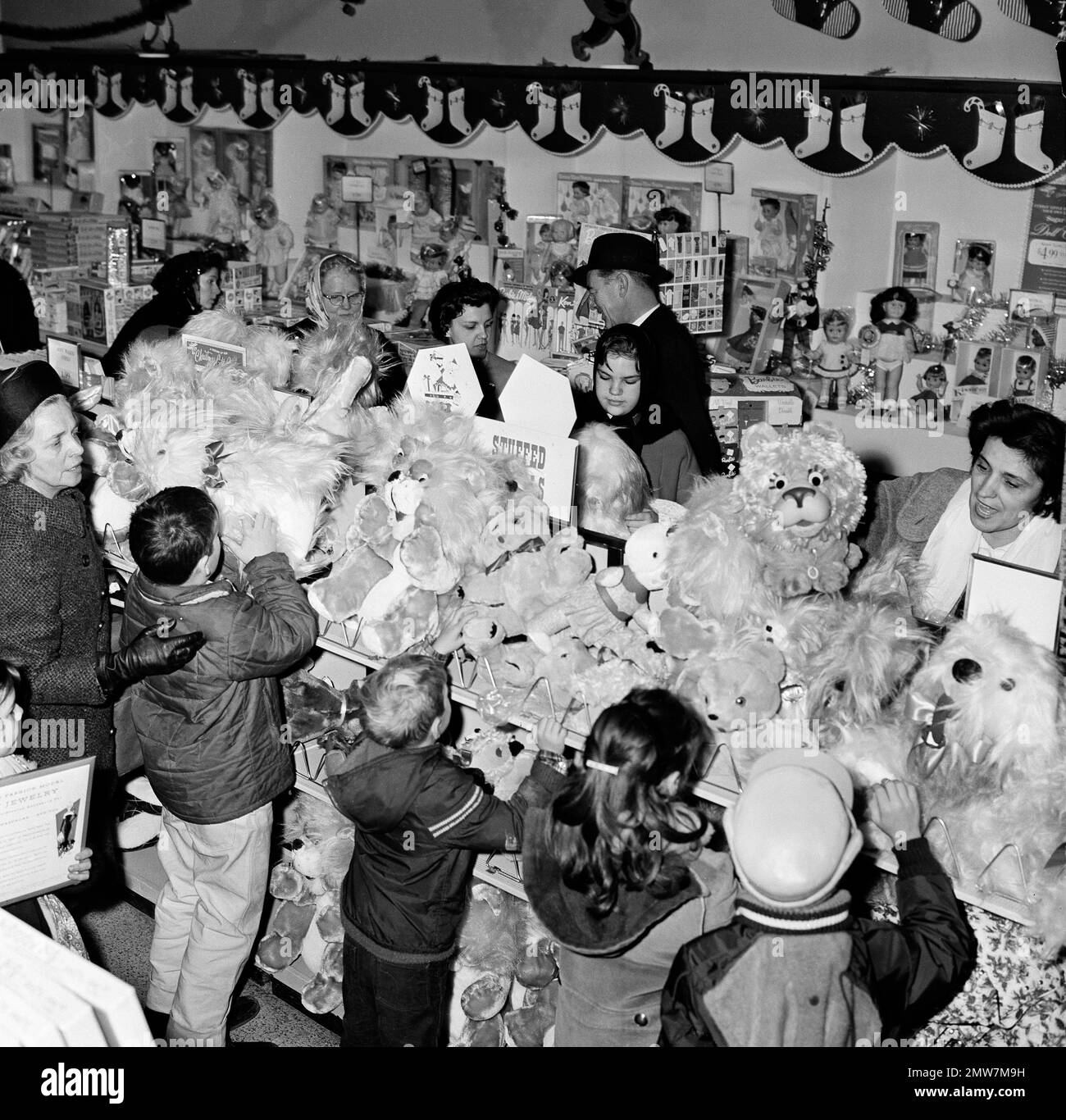 Stuffed animals draw the attention of shoppers in a Sears department ...