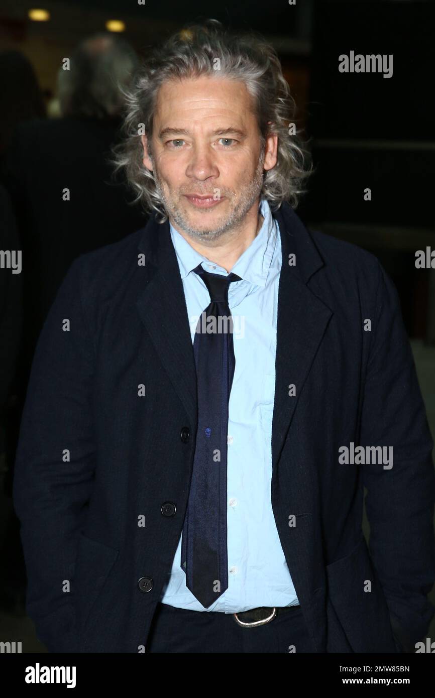 Director Dexter Fletcher poses for photographers at the Empire Film