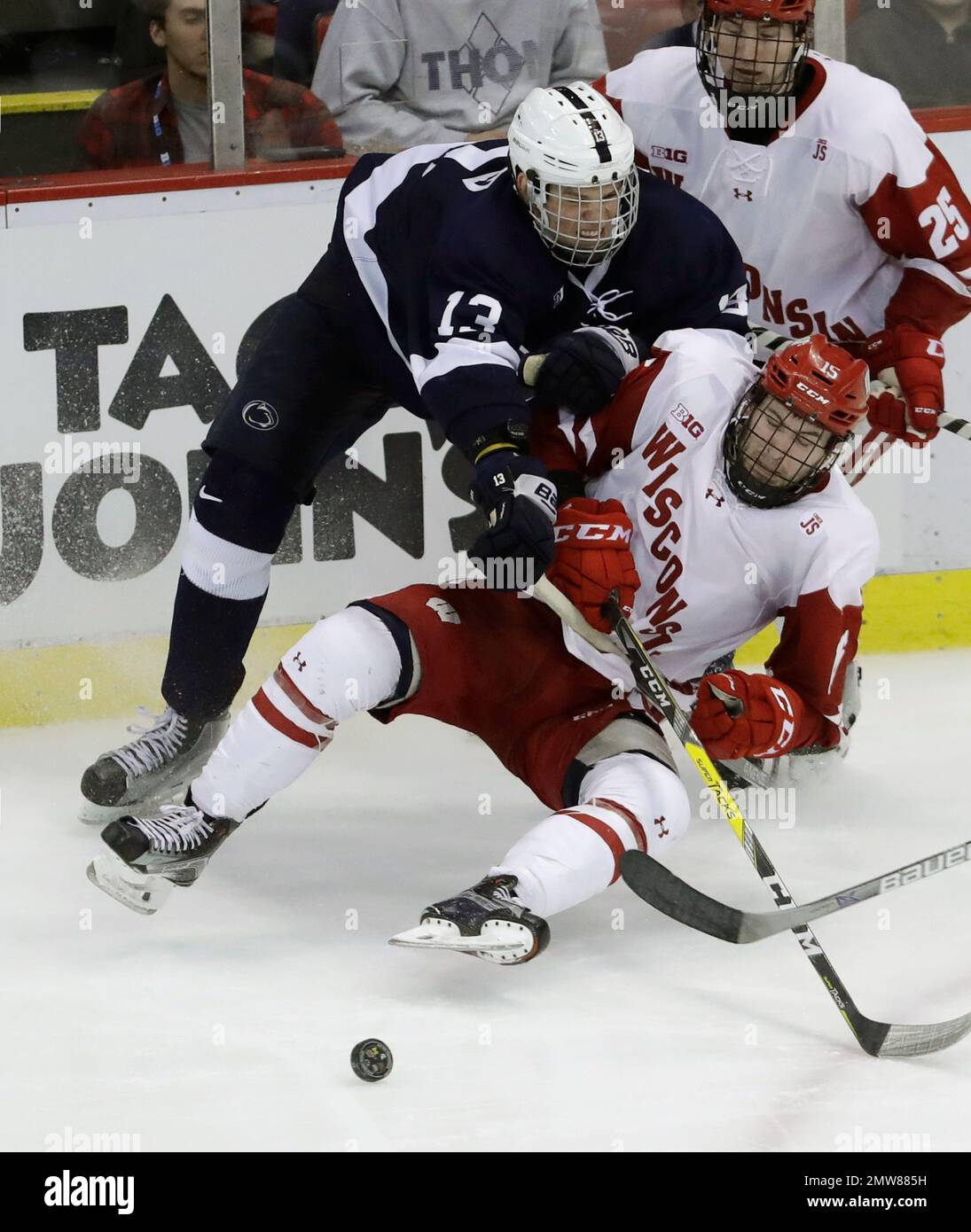 Penn State forward Nikita Pavlychev (13) reaches over Wisconsin forward