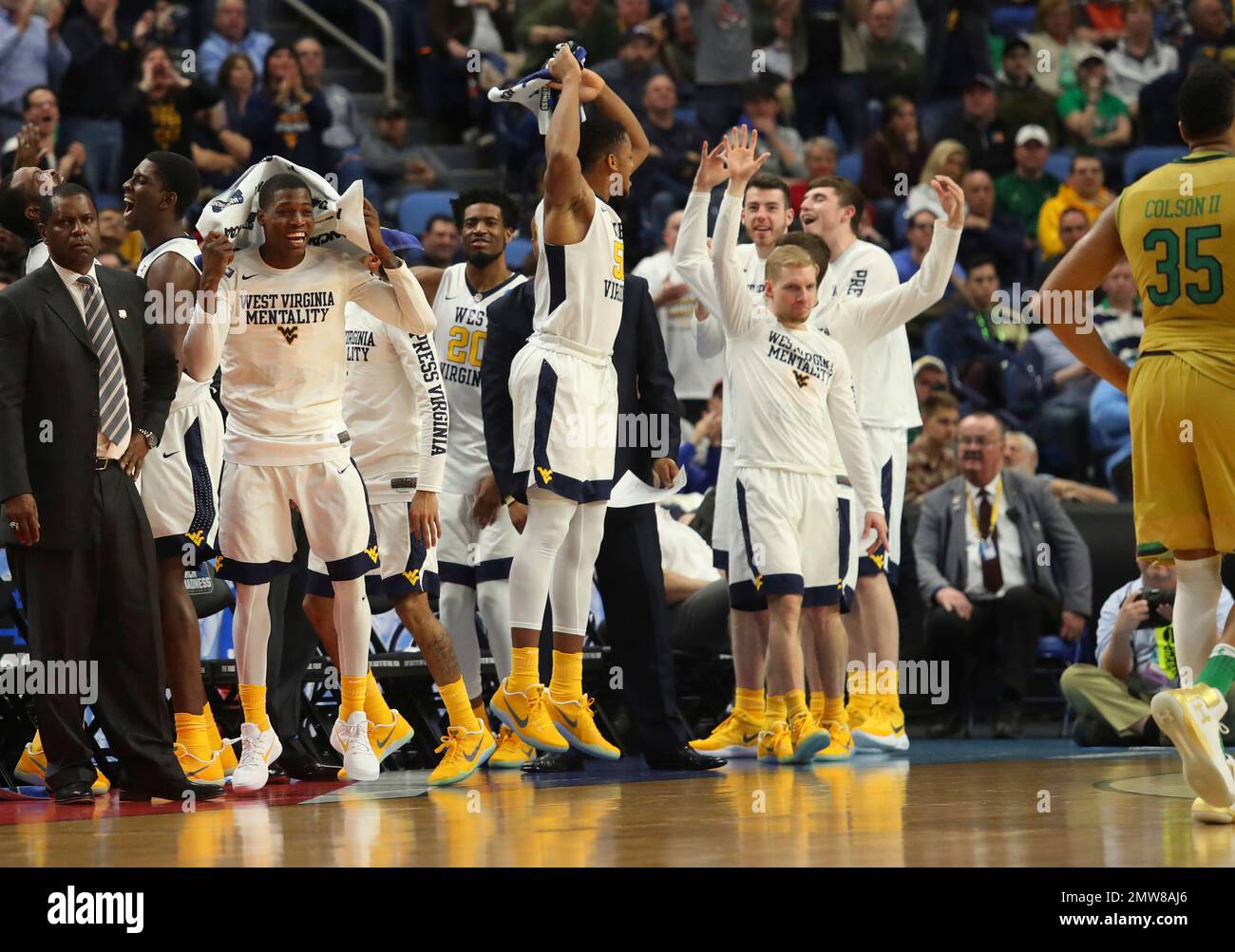 West Virginia players celebrate in the closing moments of their 8371