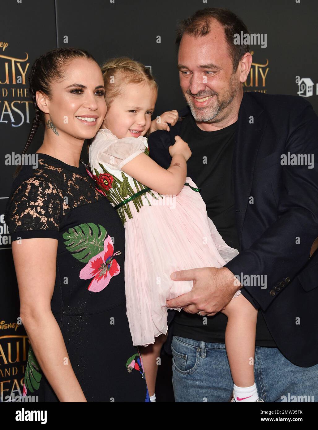 Trey Parker, left, and Boogie Tillmon and their daughter attend a