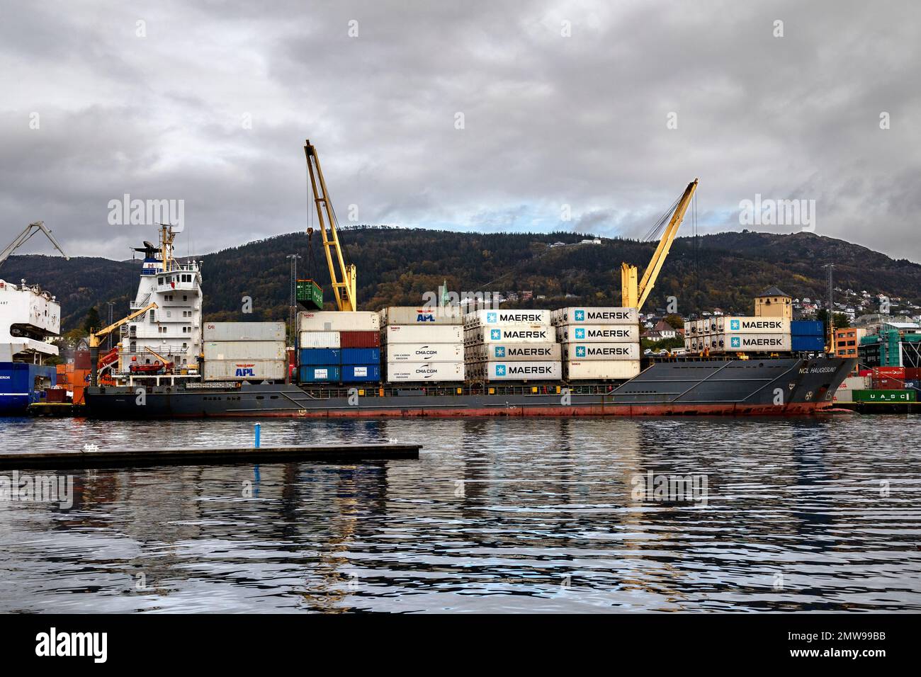 Container vessel NCL Haugesund at Frieleneskaien quay, in the port of Bergen, Norway. Stock Photo