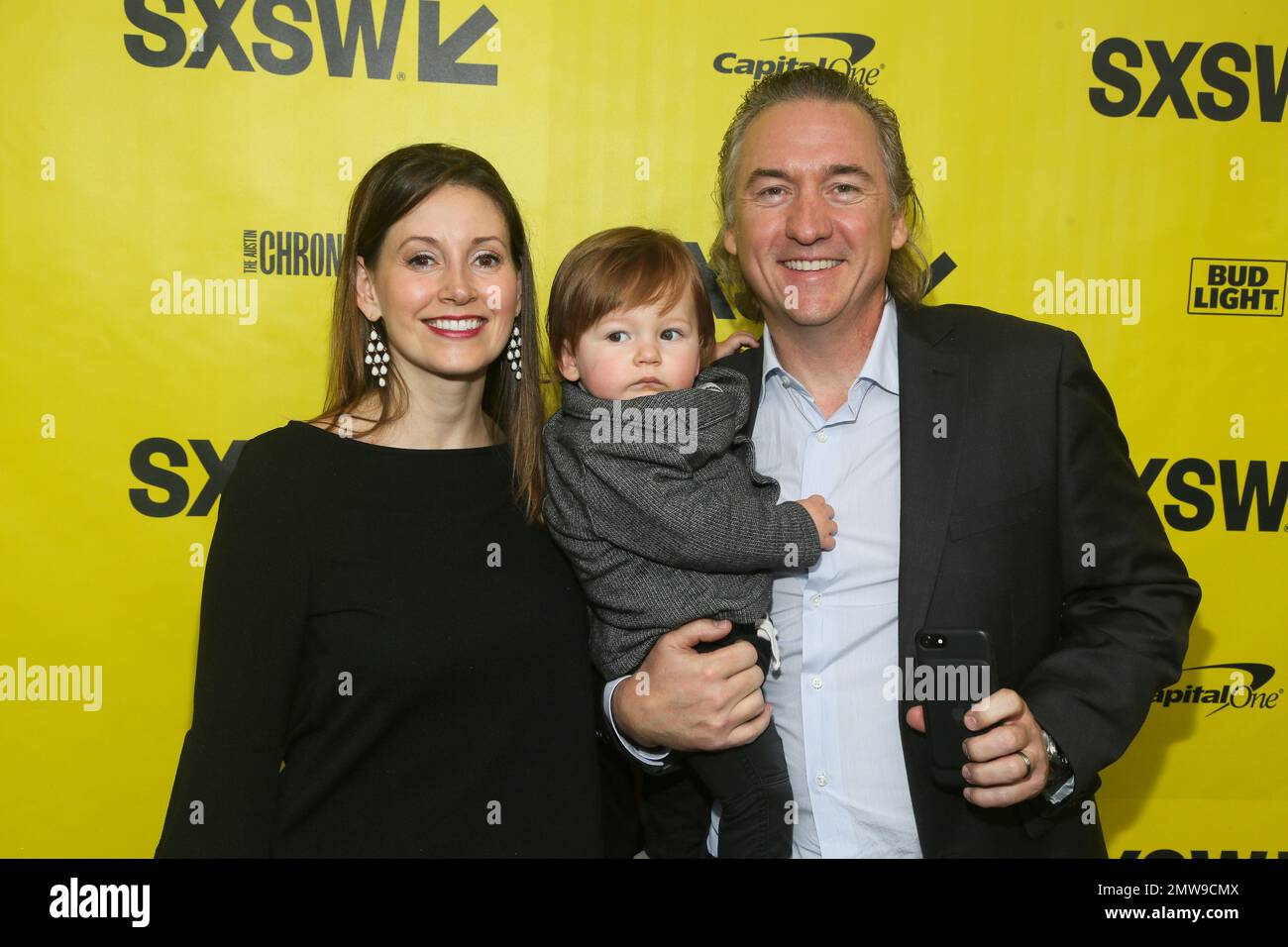 Producer John J. Kelly, his wife, Crystal and their son, Lincoln, arrive at  the world premiere of \, image size:1300x956