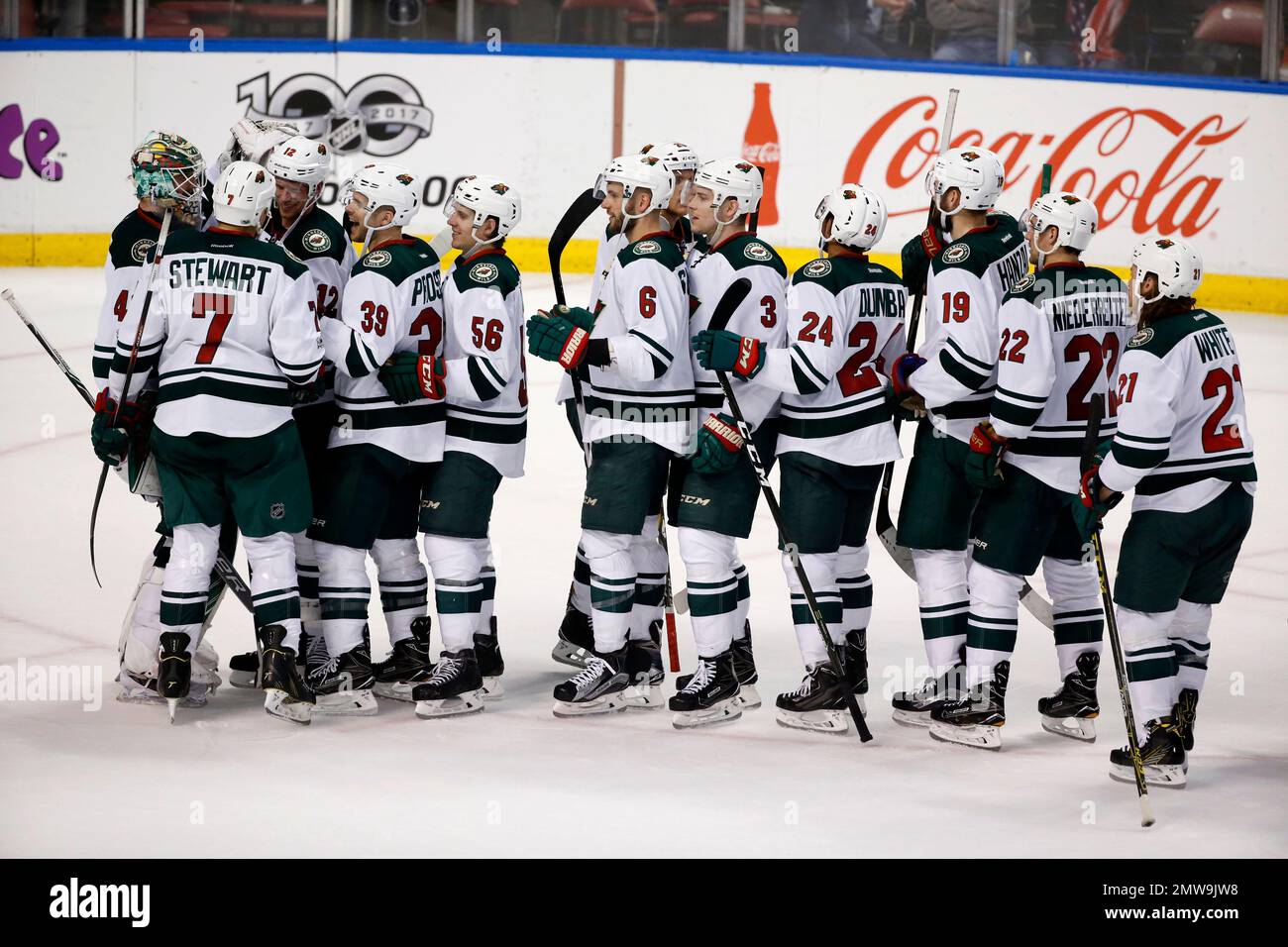 Minnesota Wild players celebrate after defeating the Florida Panthers