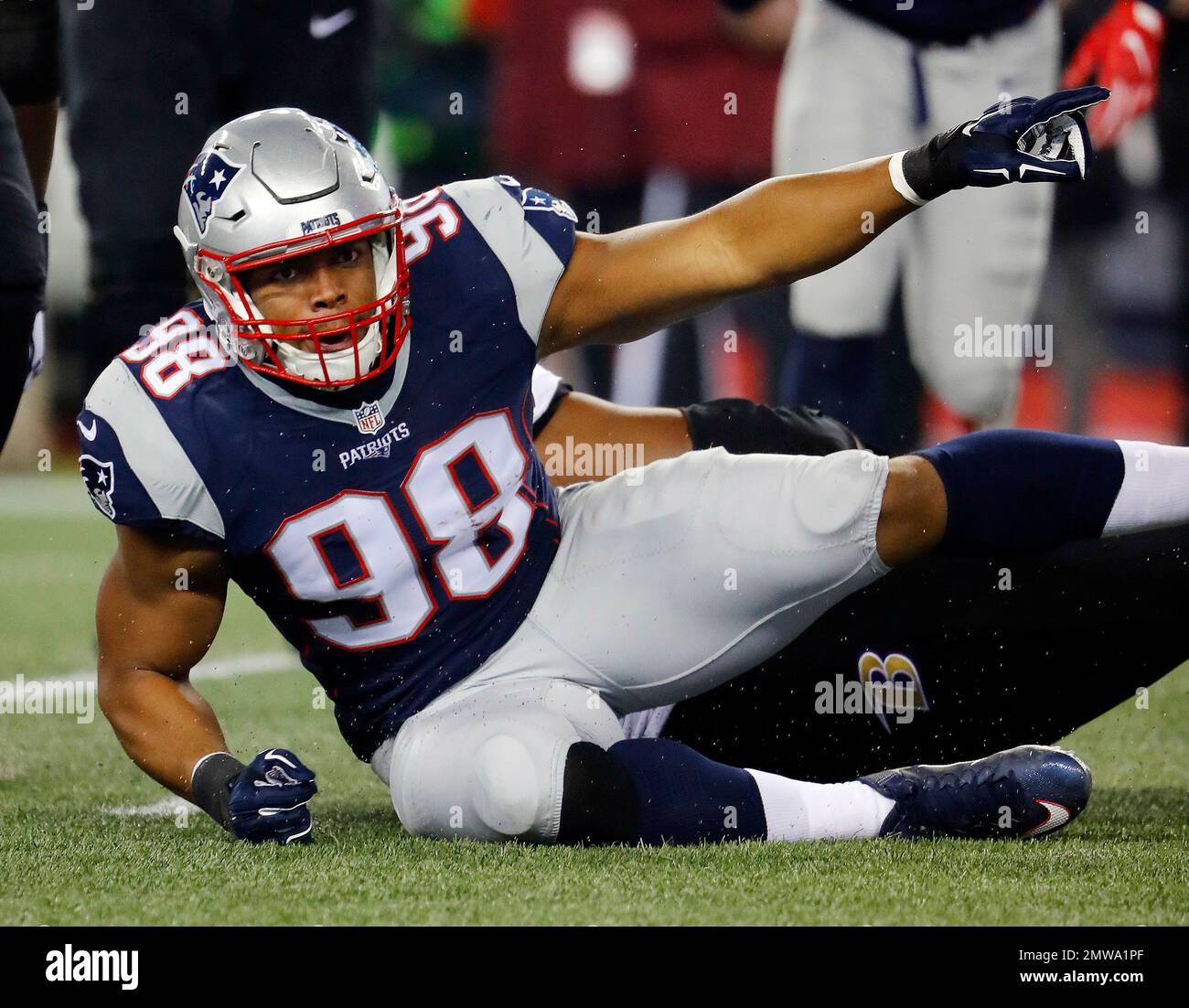 New England Patriots defensive end Trey Flowers signals a turnover