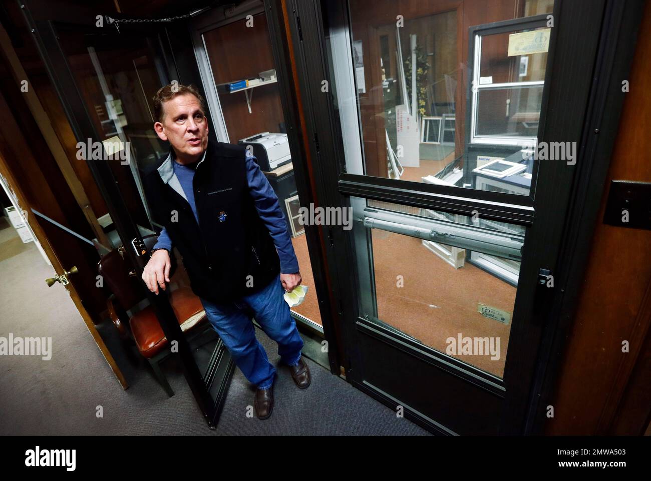 In this Jan. 17, 2017, photo, Brian Vincent stands in a door display in