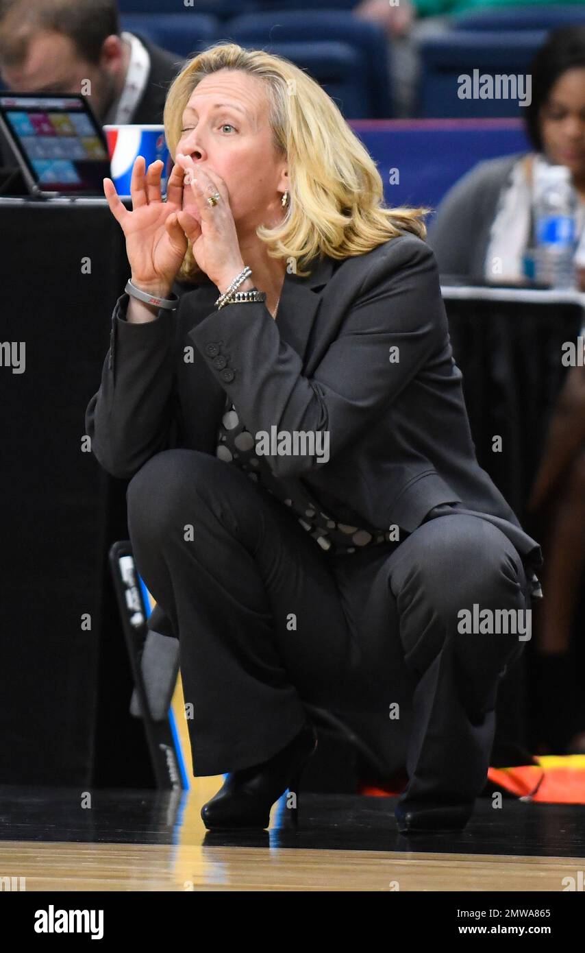 Rider head coach Lynn Milligan yells instructions to her players from ...