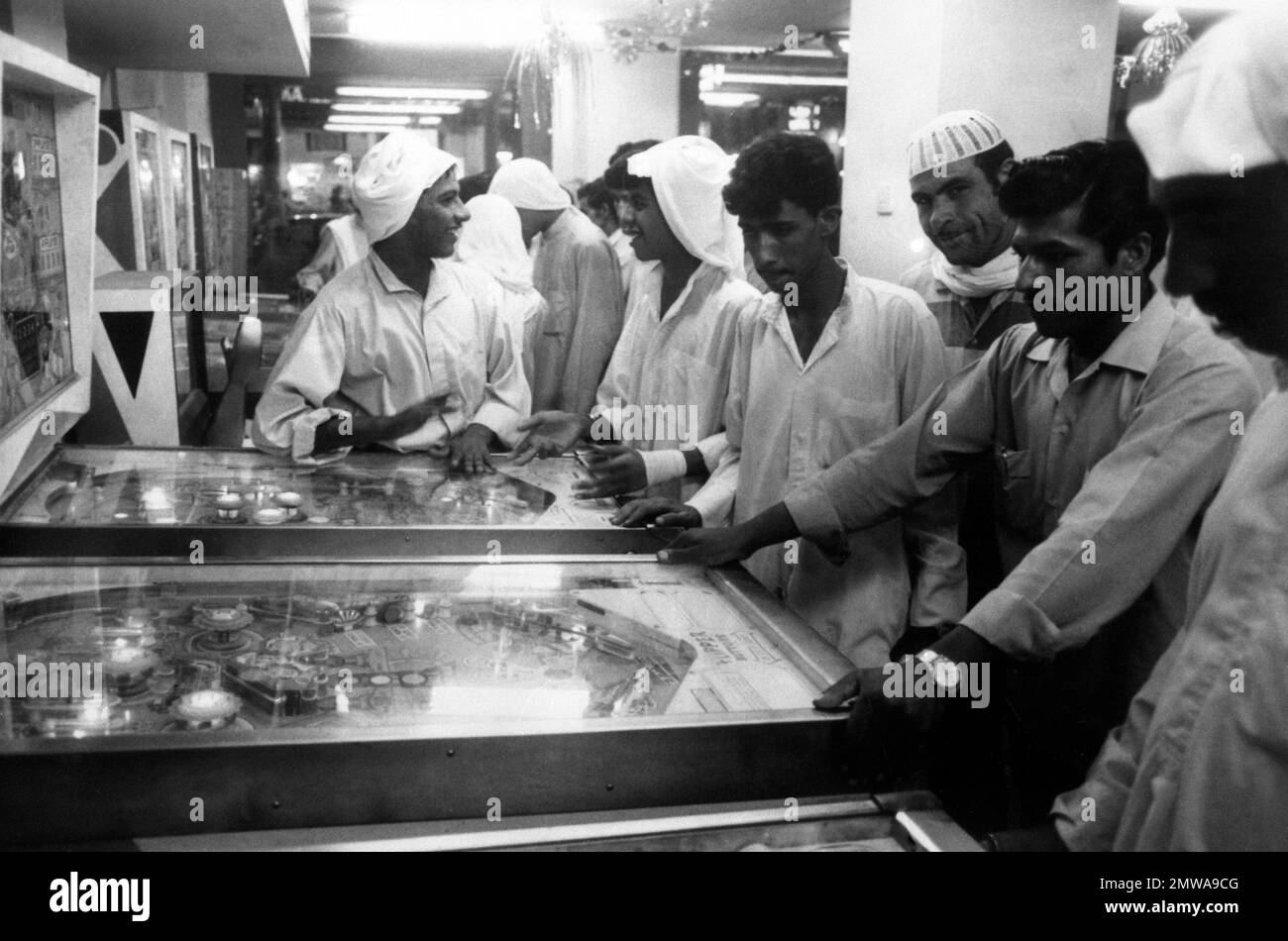 Young Kuwaitis spend the evening playing in a crowded saloon in Kuwait City on January 4, 1972
