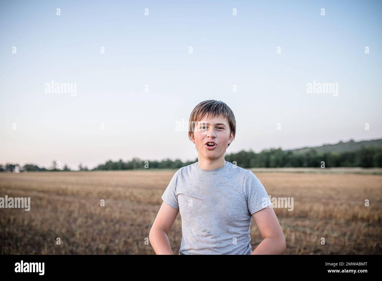 Portrait of a teenager who says something in the process of shooting