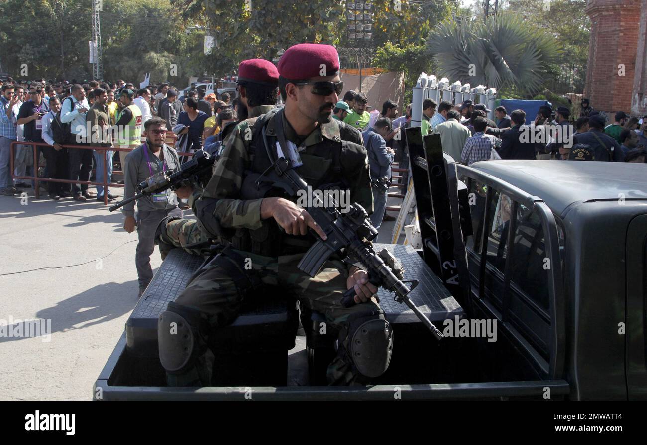Pakistani army commandos stand guard beside the cricket lovers waiting ...