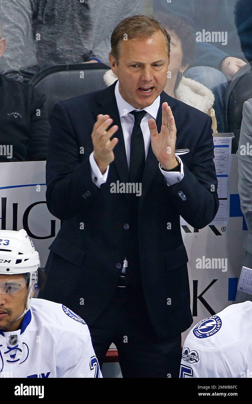 Tampa Bay Lightning coach Jon Cooper stands behind his bench during the