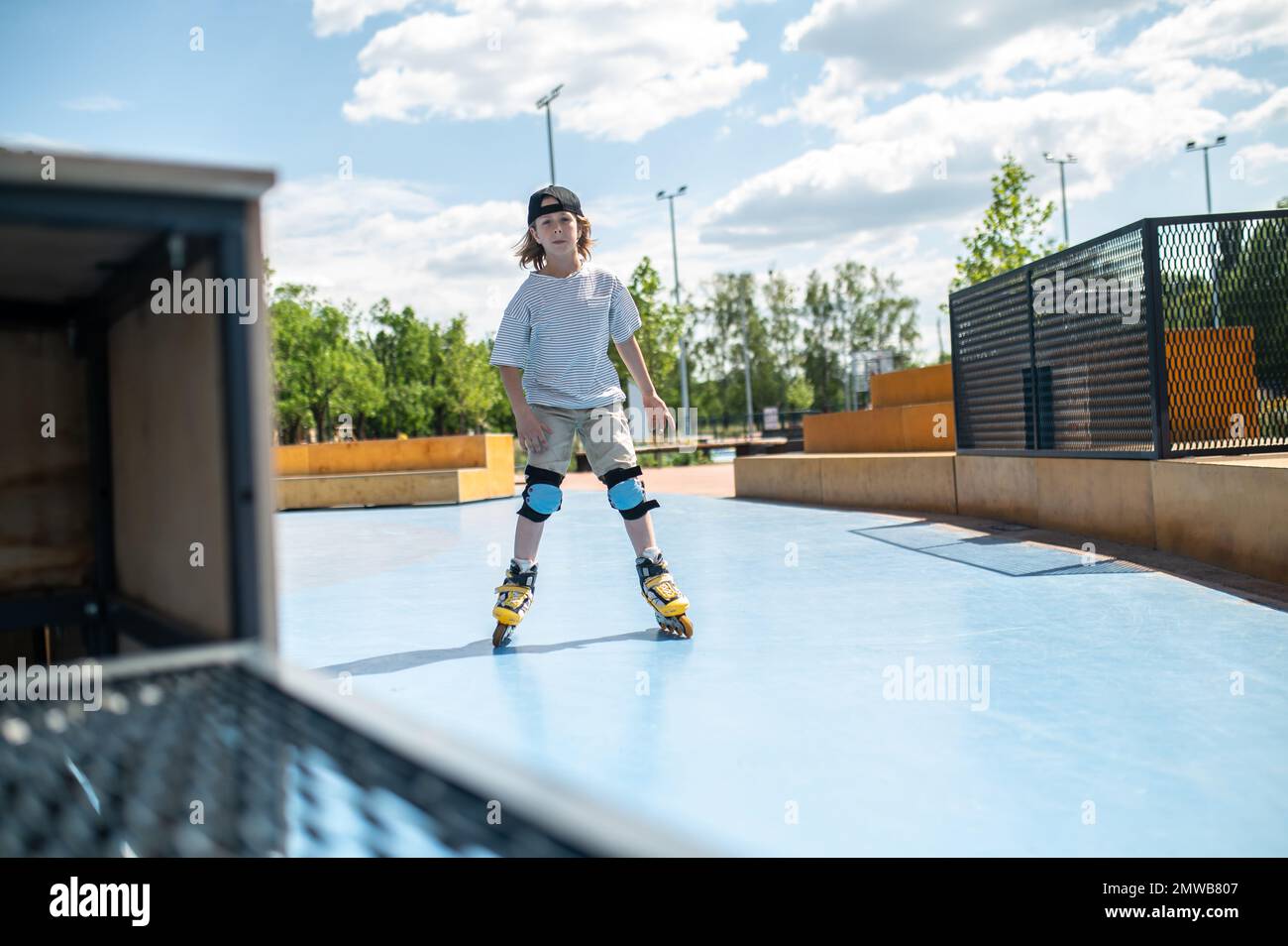 Person Riding Roler Skates Boy riding on the roller skates outdoors Stock Photo - Alamy