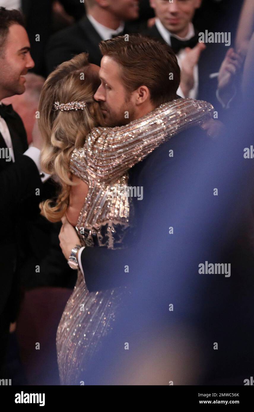 Ryan Gosling, right, embraces sister Mandi Gosling at the Oscars on(01)