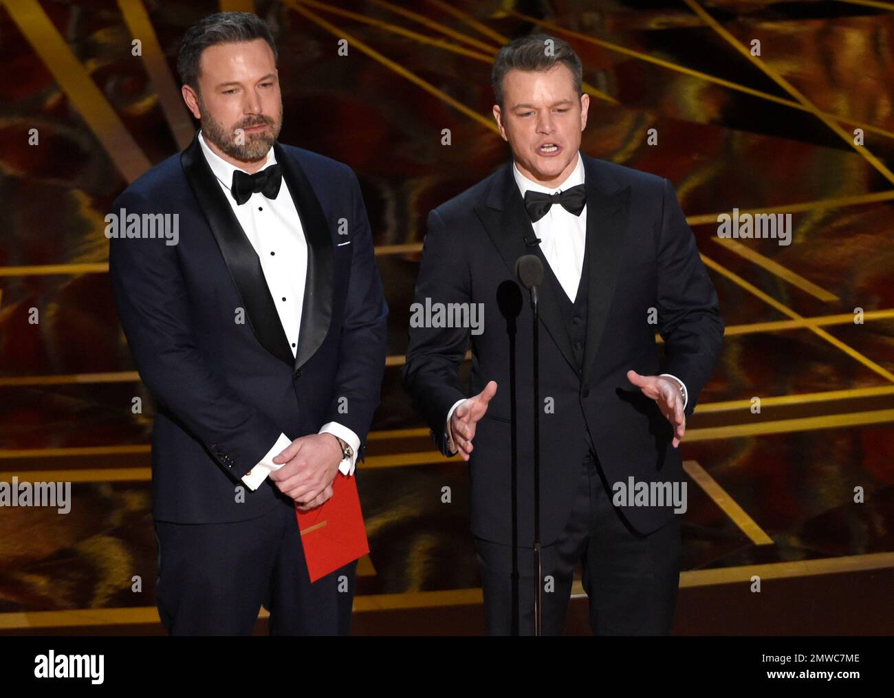 Ben Affleck, left, and Matt Damon present the award for best original