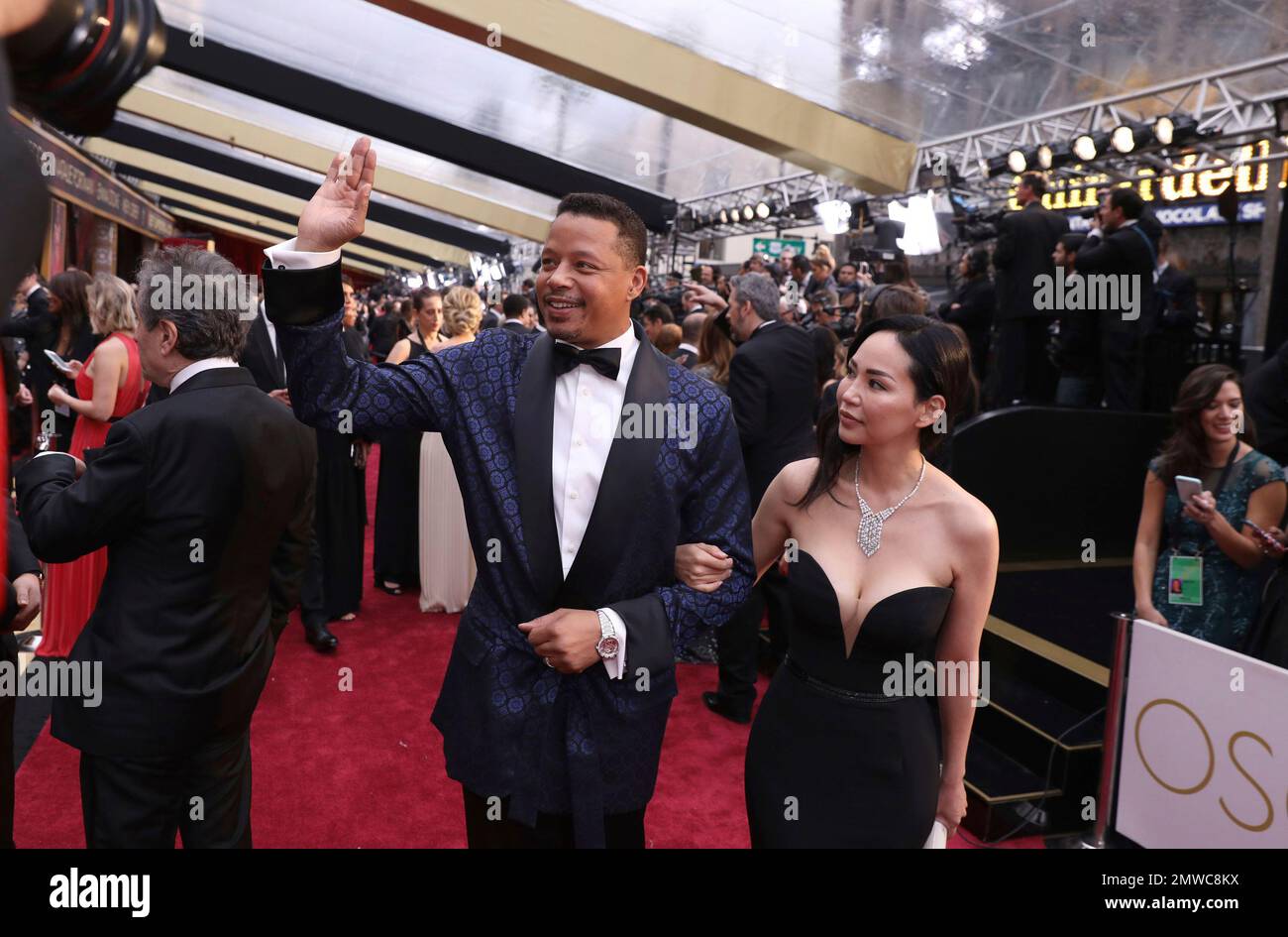 Terrence Howard, left, and Miranda Pak arrive at the Oscars on Sunday