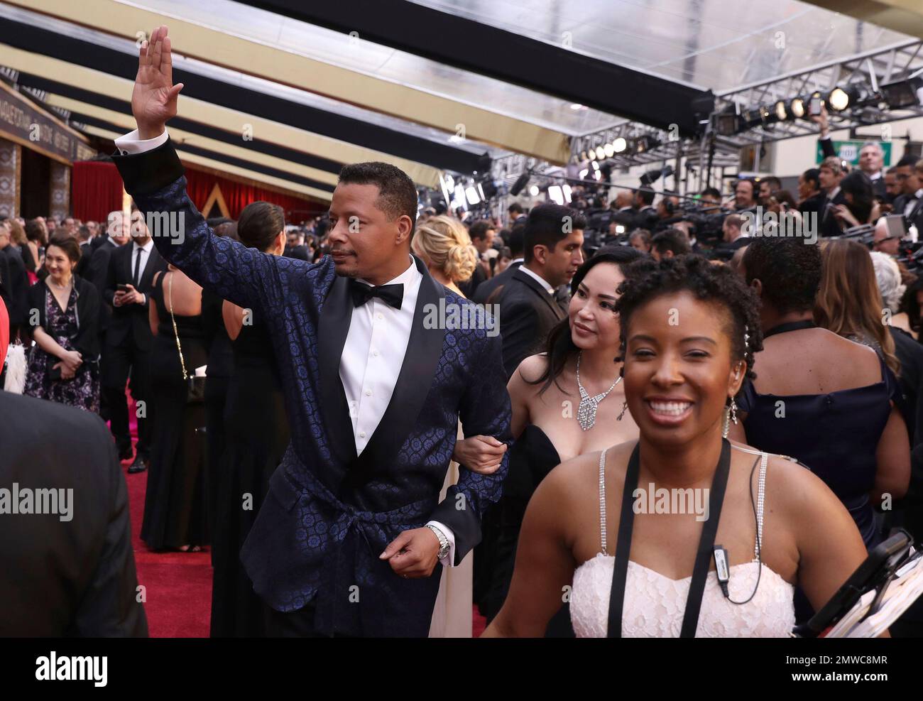 Terrence Howard, left, and Miranda Pak arrive at the Oscars on Sunday