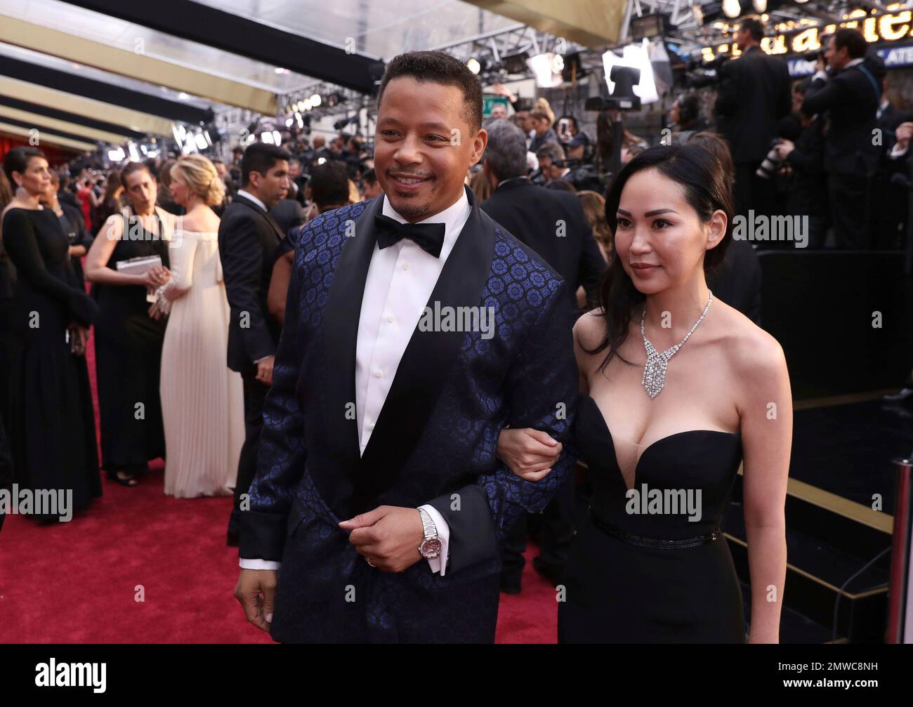 Terrence Howard, left, and Miranda Pak arrive at the Oscars on Sunday