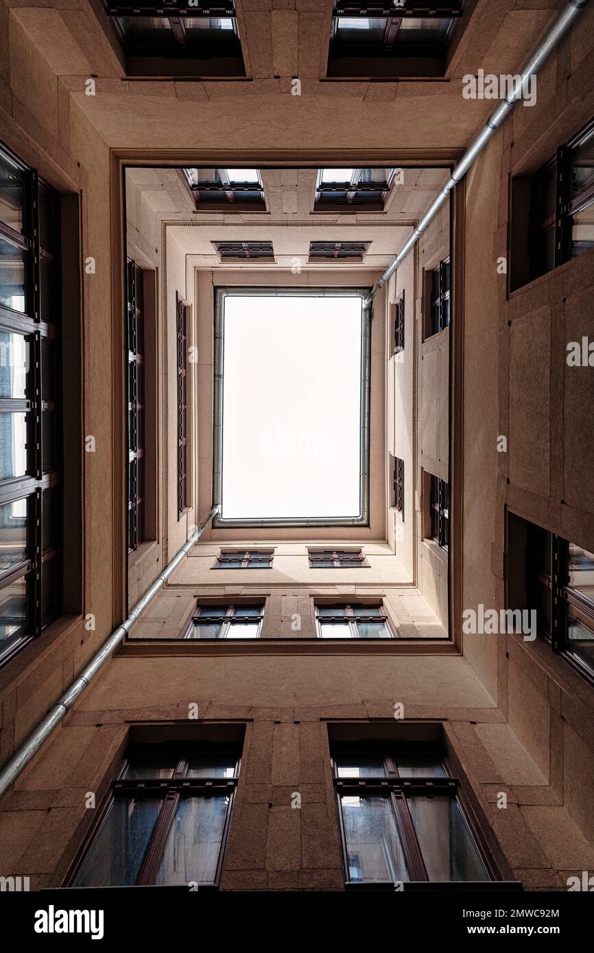 Narrow, dreary courtyard, view upwards, text-free space, Budapest, Hungary Stock Photo