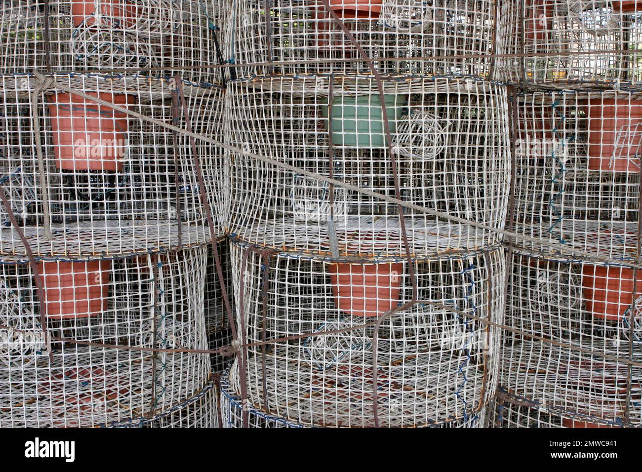 Stacked fish traps with cork buoys, Spain Stock Photo