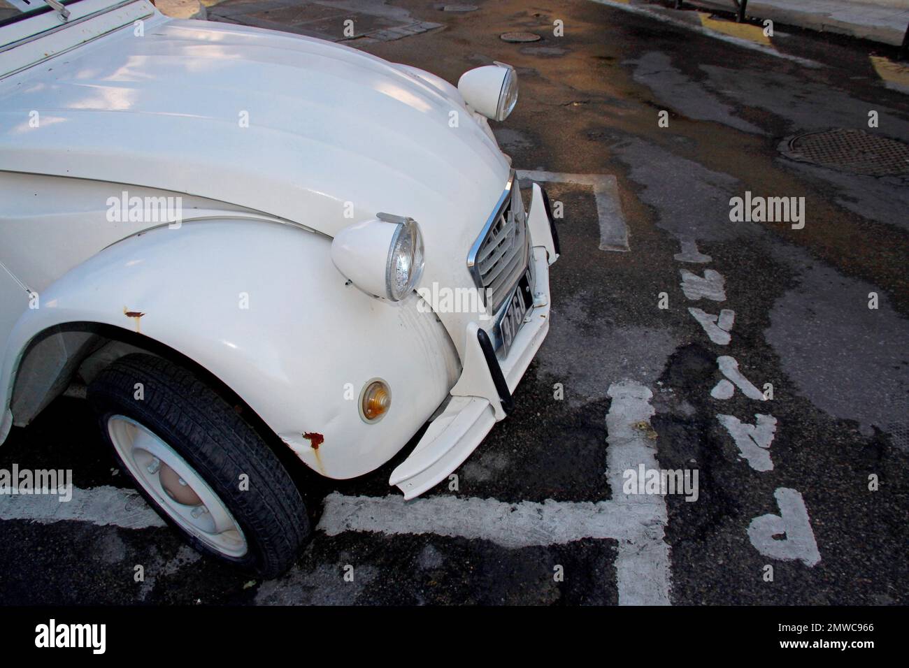 Side view of the front of a white Citroen 2CV in a car park, duck, Deux chevaux, France Stock Photo