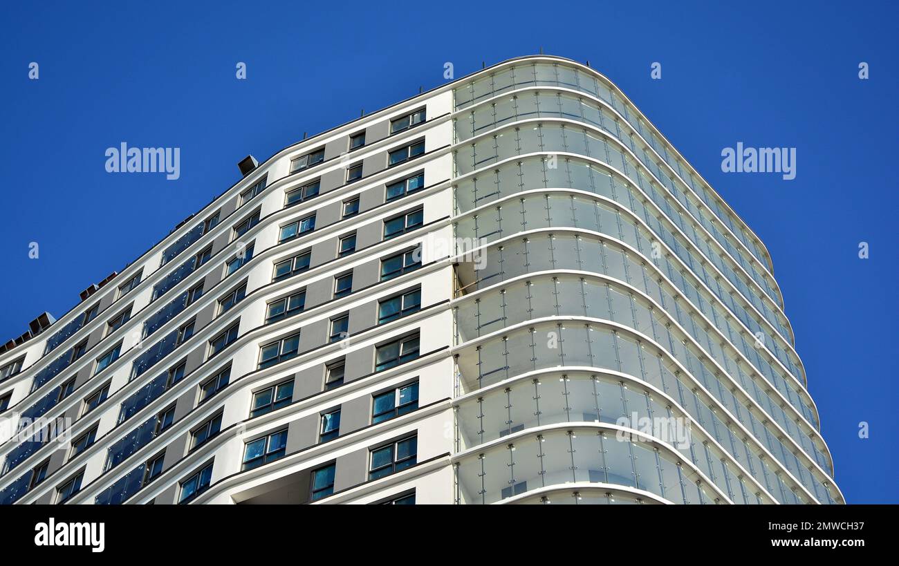 New apartment building with glass balconies. Modern architecture houses ...