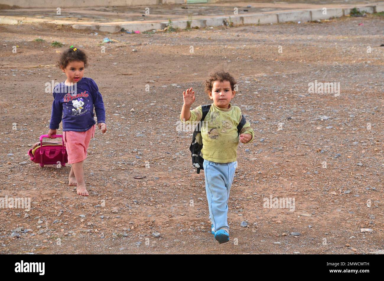 Girl and boy with school bags come from school, Morocco Stock Photo Alamy