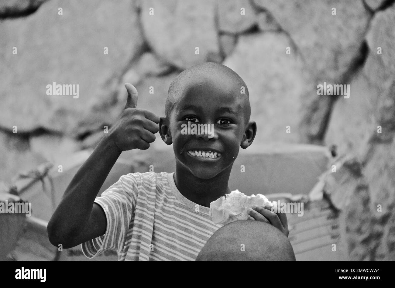 Black boy with full mouth laughing in camera, Spain Stock Photo Alamy