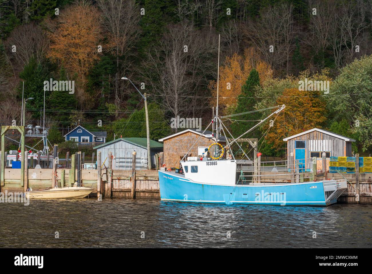 Fishing boats with fall foliage in St. Martins, New Brunswick, Canada