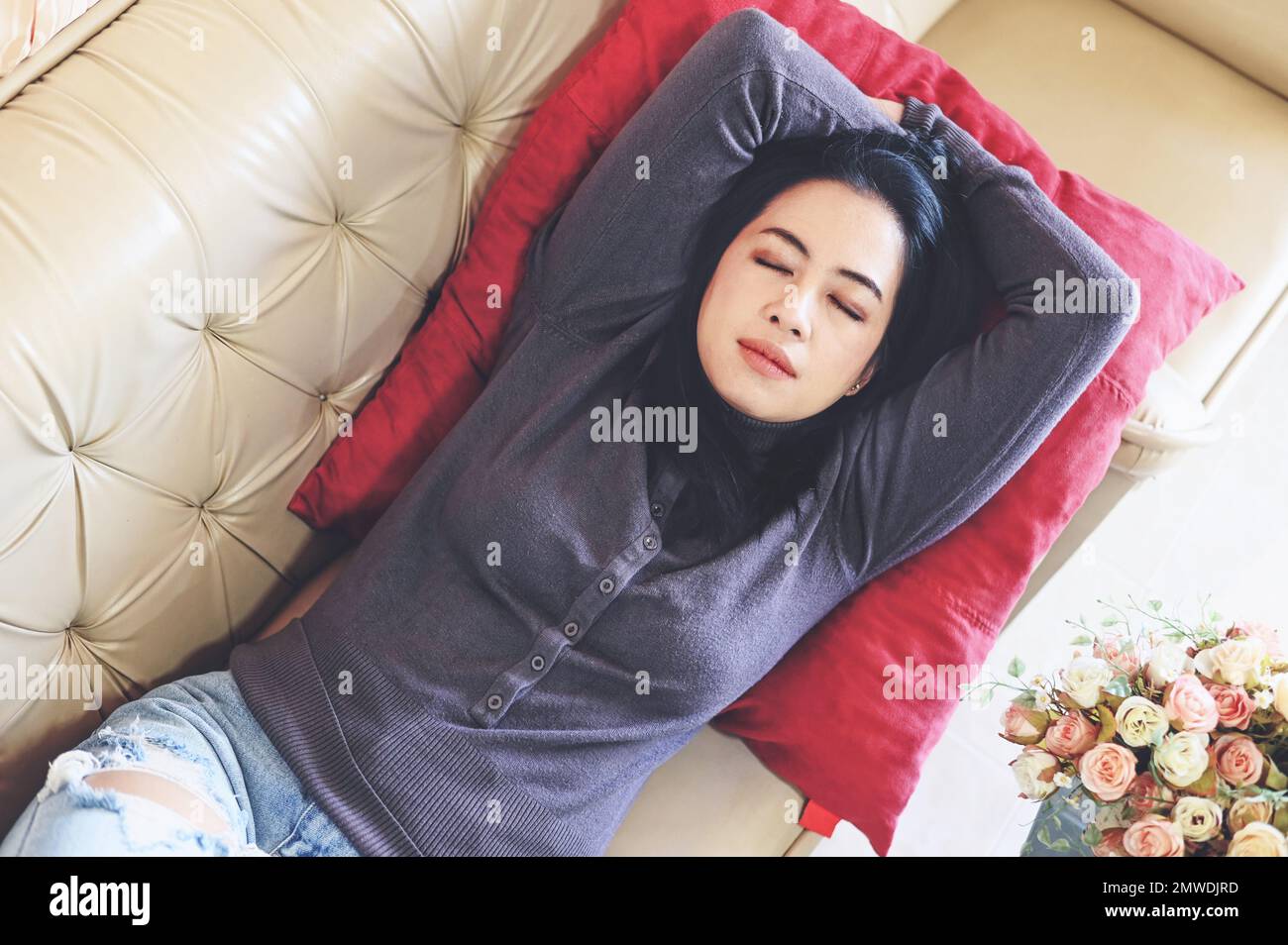 sleeping on the sofa woman relaxing sleeping on couch at home, relaxed