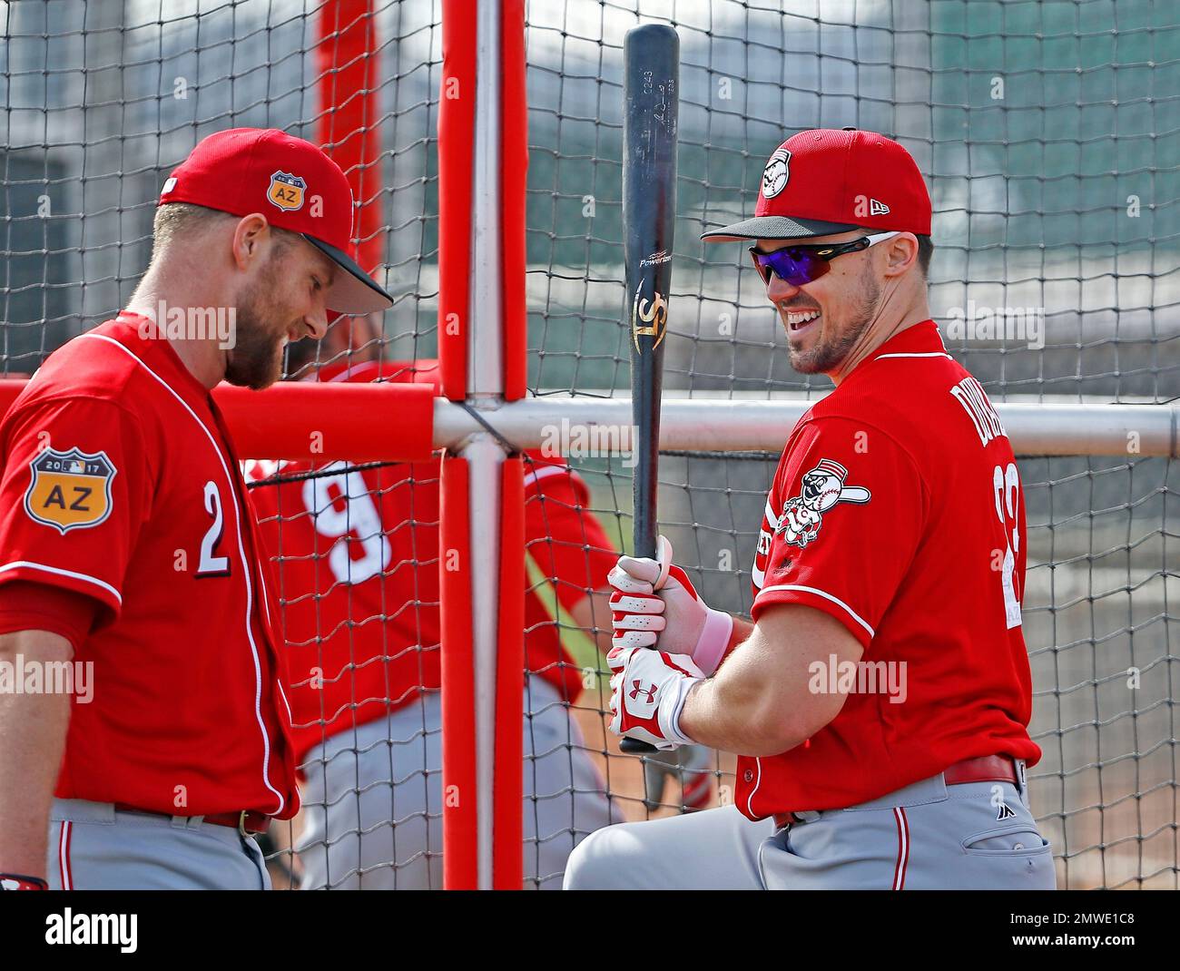 Cincinnati Reds' Adam Duvall, right, and Zack Cozart (2) share a laugh