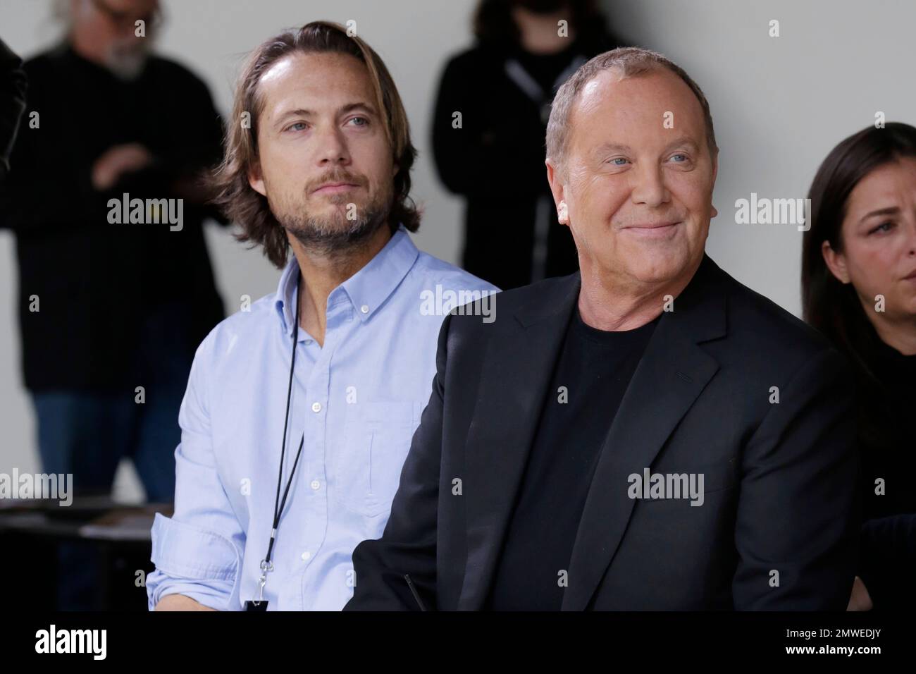 Designer Michael Kors, right, and his husband Lance LePere, watch as models  rehearse on the runway before Kors collection is modeled during Fashion  Week in New York, Wednesday, Feb. 15, 2017. (AP