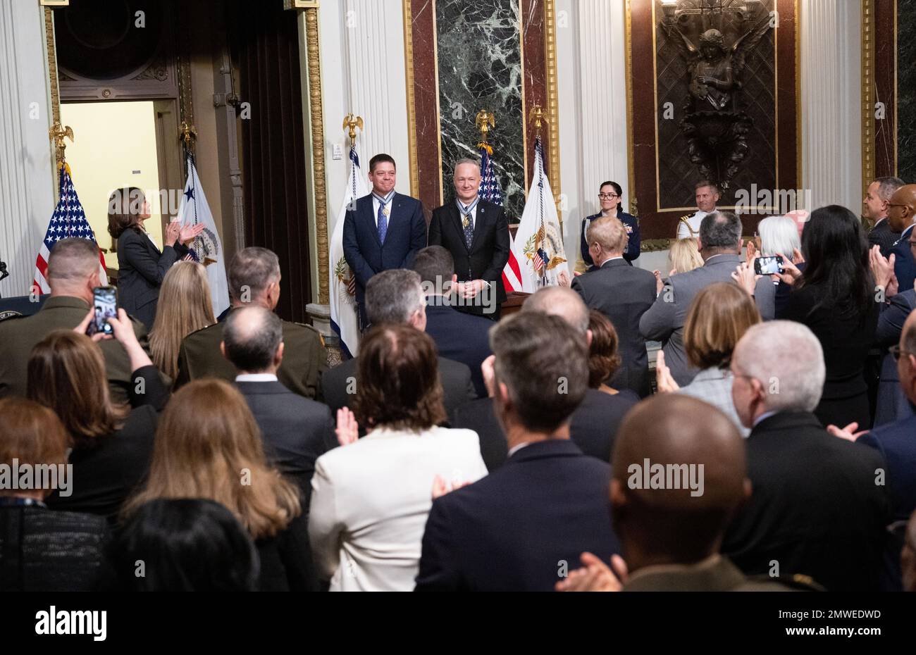 Washington, United States of America. 31 January, 2023. U.S Vice President Kamala Harris, left, applauds former NASA astronaut Douglas Hurley, right, and Robert Behnken, left, after awarding them the Congressional Space Medal of Honor during a ceremony in the Indian Treaty Room of the Eisenhower Executive Office Building at the White House, January 31, 2023 in Washington, DC Hurley and Behnken were awarded the medal for bravery in the NASA SpaceX Demonstration Mission-2 to the International Space Station. Credit: Joel Kowsky/NASA/Alamy Live News Stock Photo
