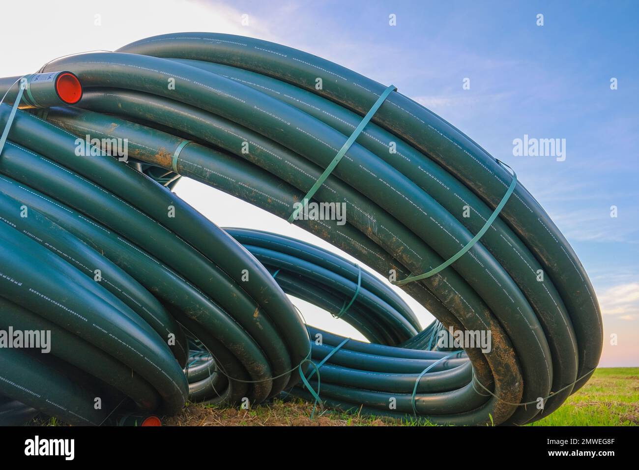 Pipe laying. Plumbing plastic pipes in rolls .Plumbing equipment