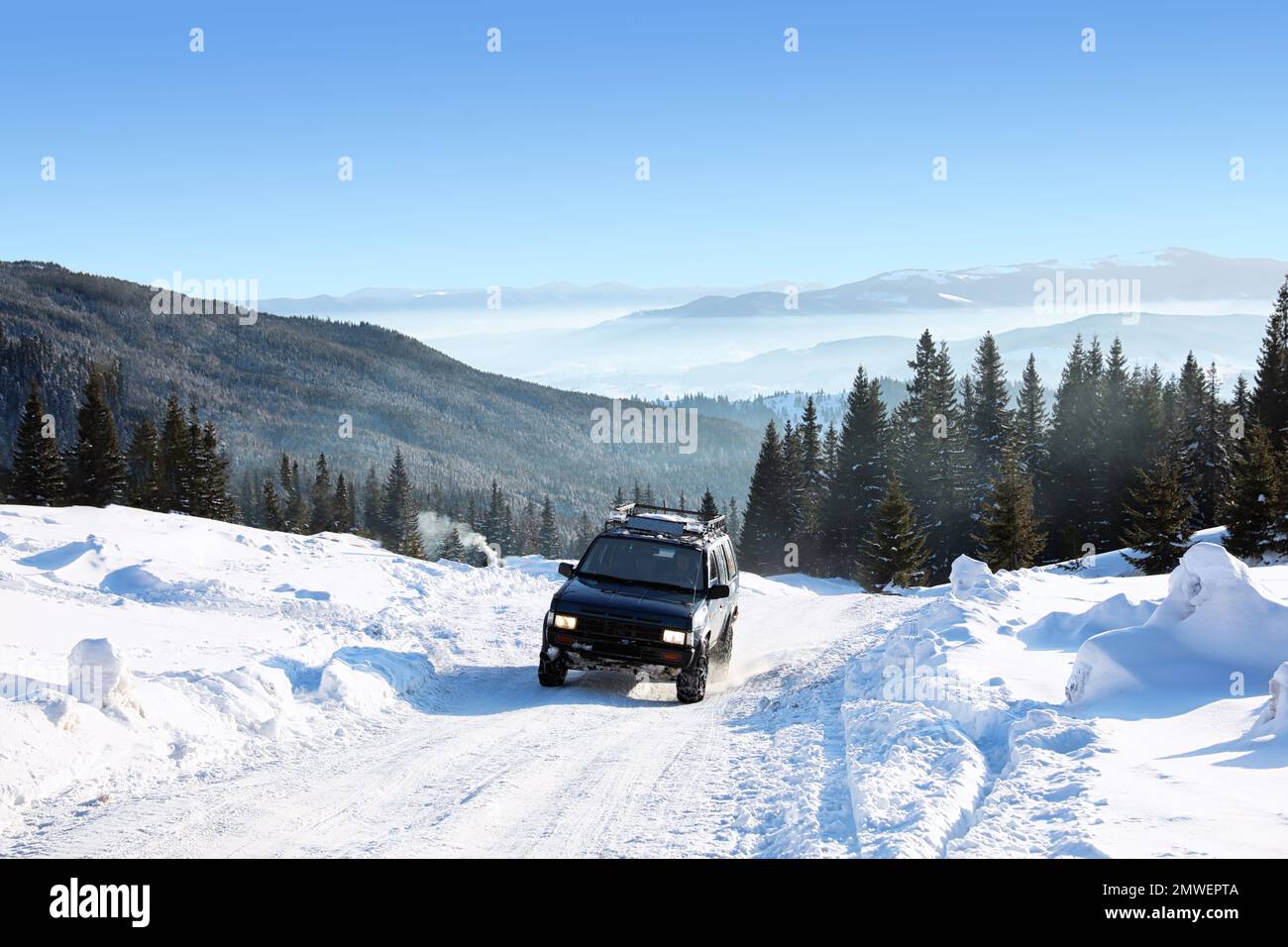 Modern car on snowy country road. Winter vacation Stock Photo - Alamy