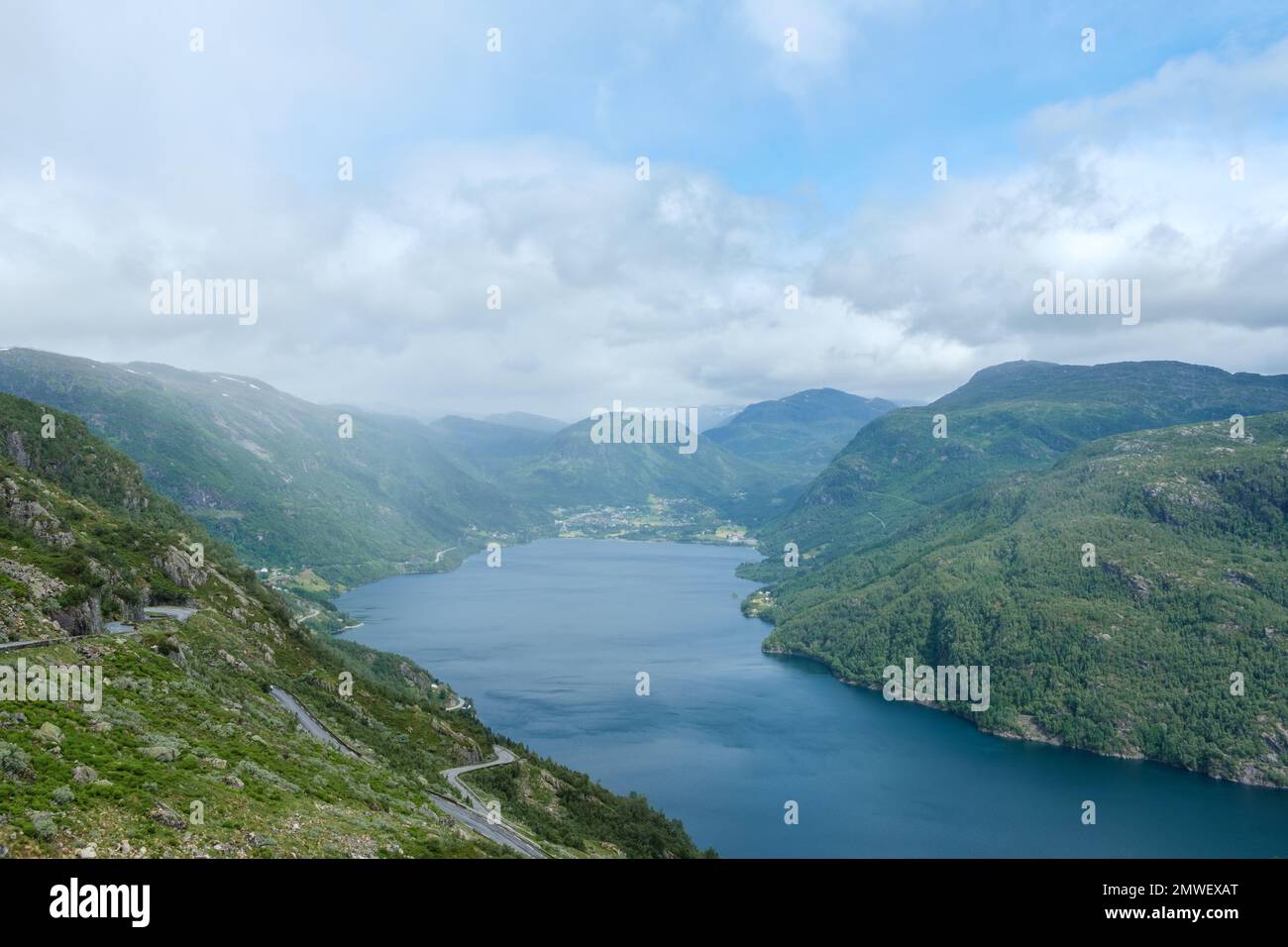 An aerial view of the beautiful fjord near green mountains in Roldal ...