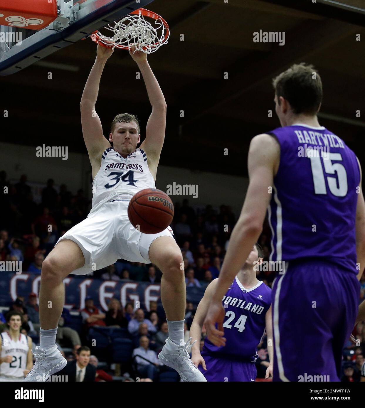 Saint Mary's Jock Landale (34) scores in front of Portland's Philipp