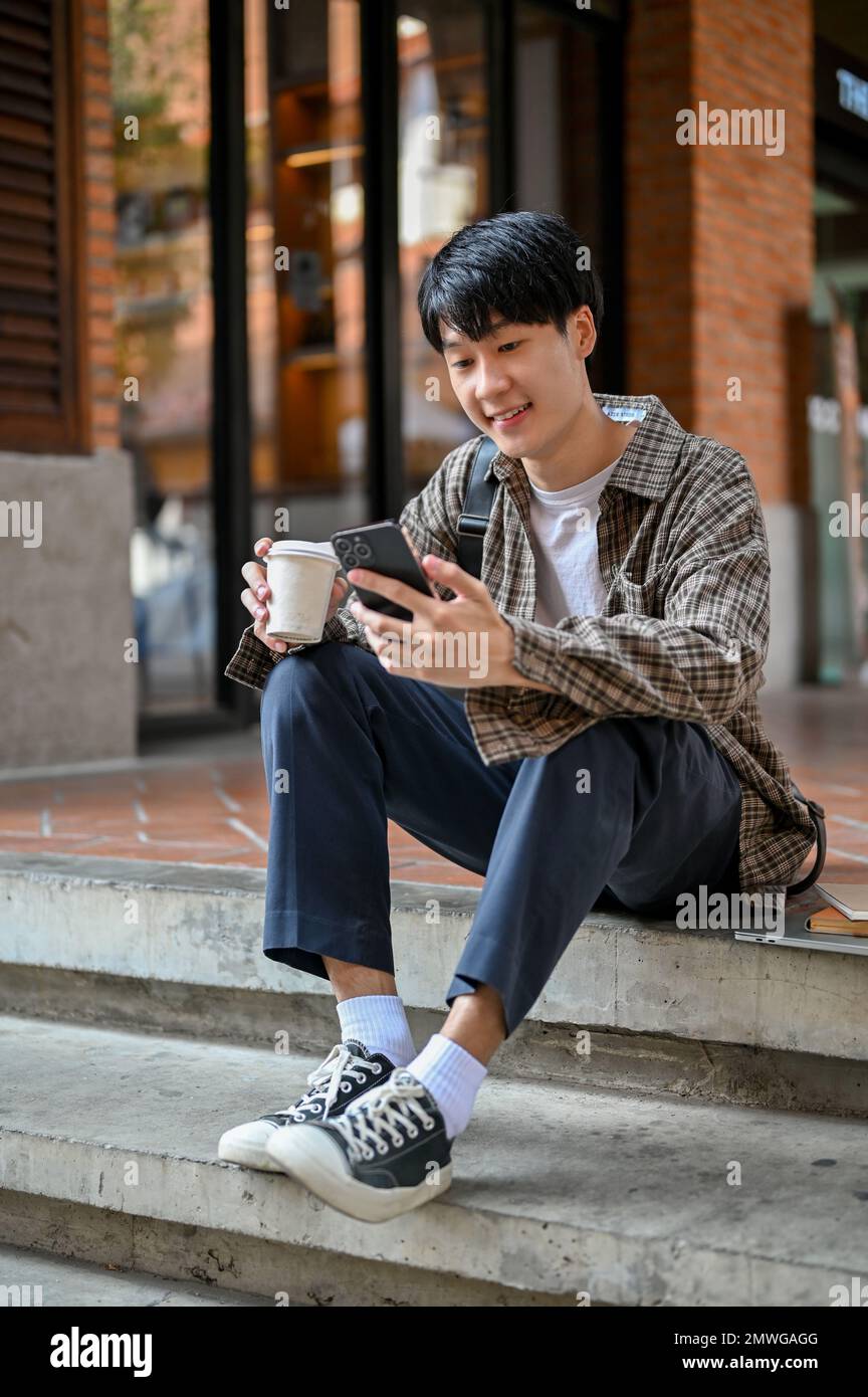Portrait, Handsome young Asian male college student in casual clothes ...