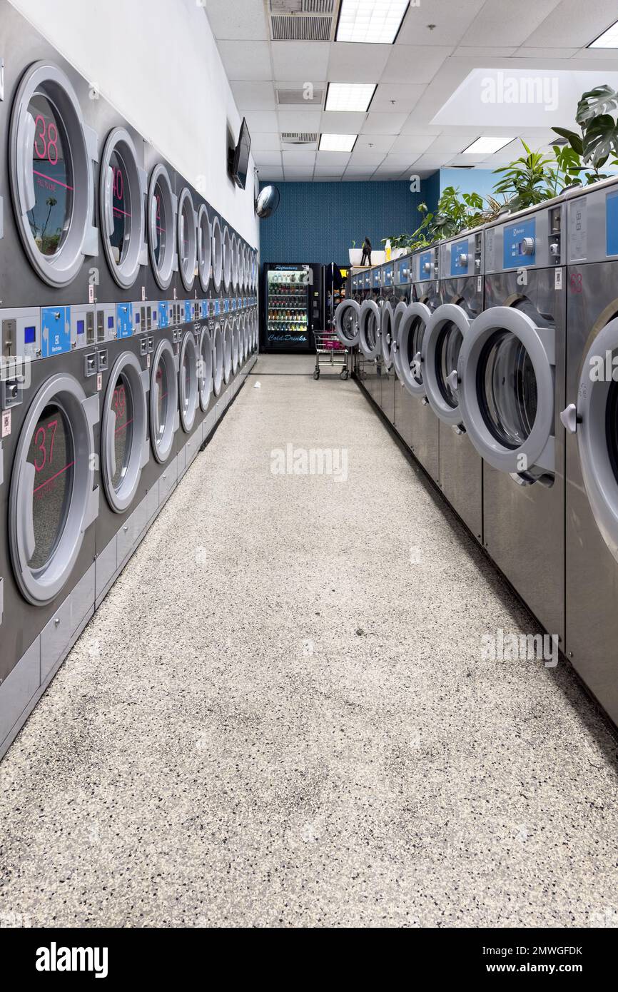 Coin laundry shop with washing machines Stock Photo