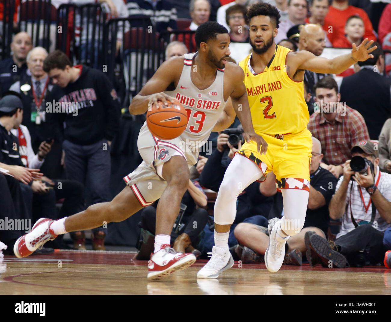 Ohio State's JaQuan Lyle, left, drives to the basket against Maryland's Melo Trimble during the