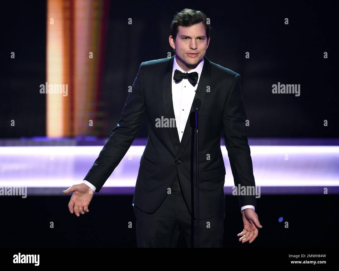 Ashton Kutcher presents the award for outstanding performance by a ...