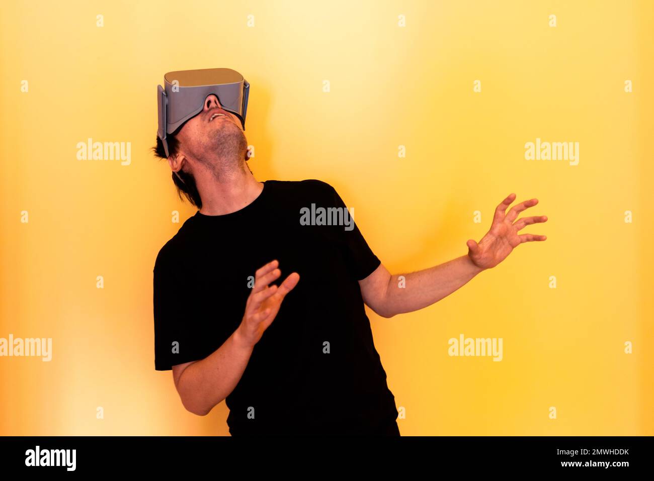 Gamer Man Using Virtual Reality Goggles Stock Photo
