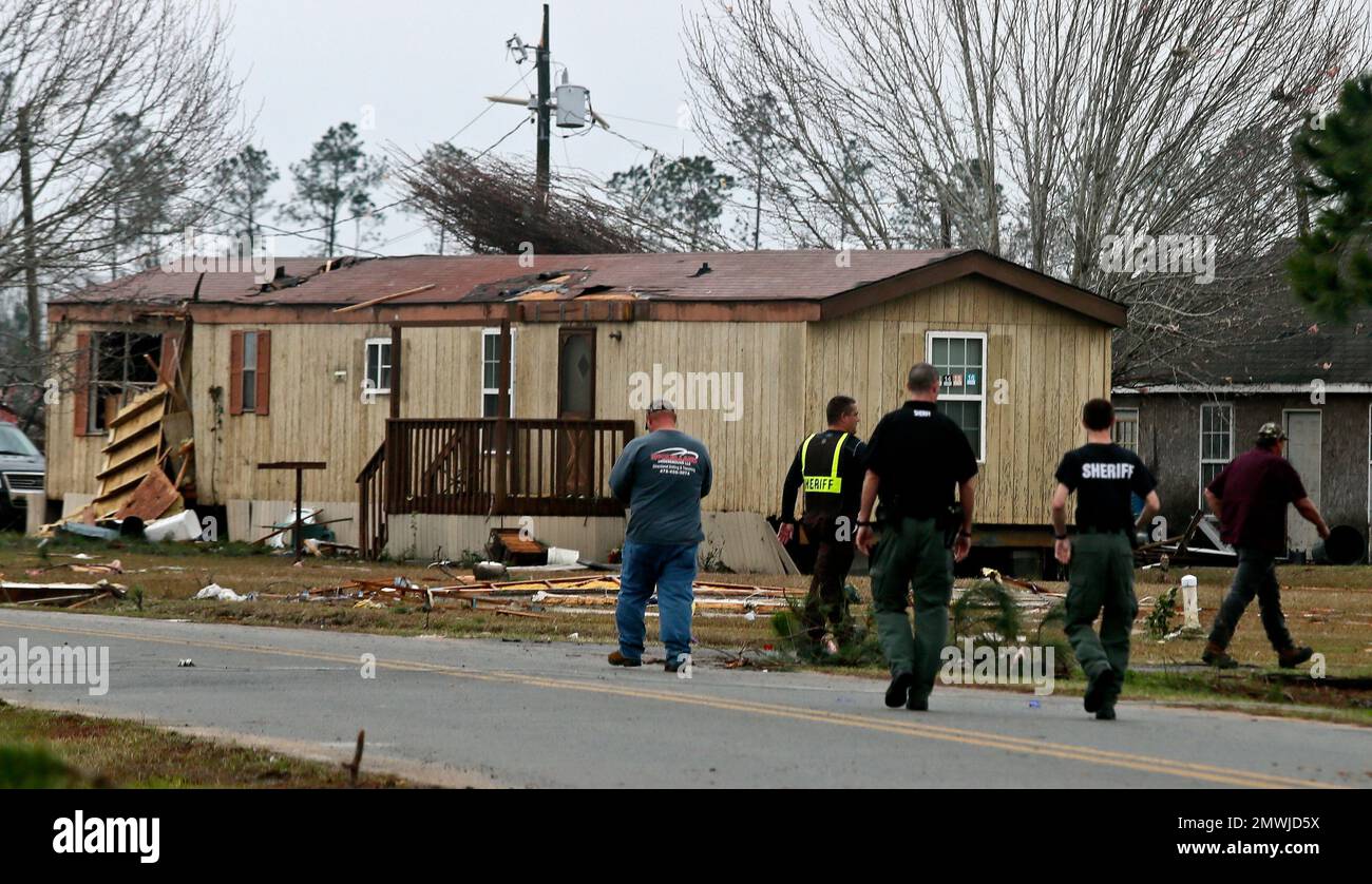 Law enforcement officials search for residents to evacuate Sunday Jan