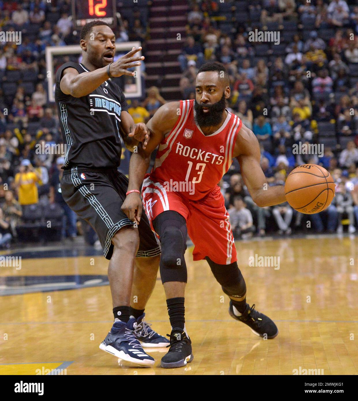 Houston Rockets guard James Harden (13) passes the ball against Memphis