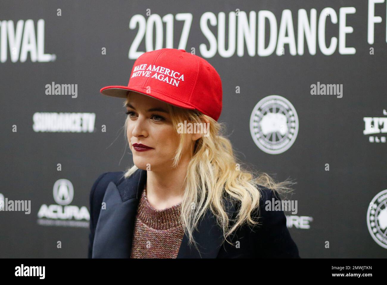 Actress Riley Keough wears a politically themed hat at the premiere of ...